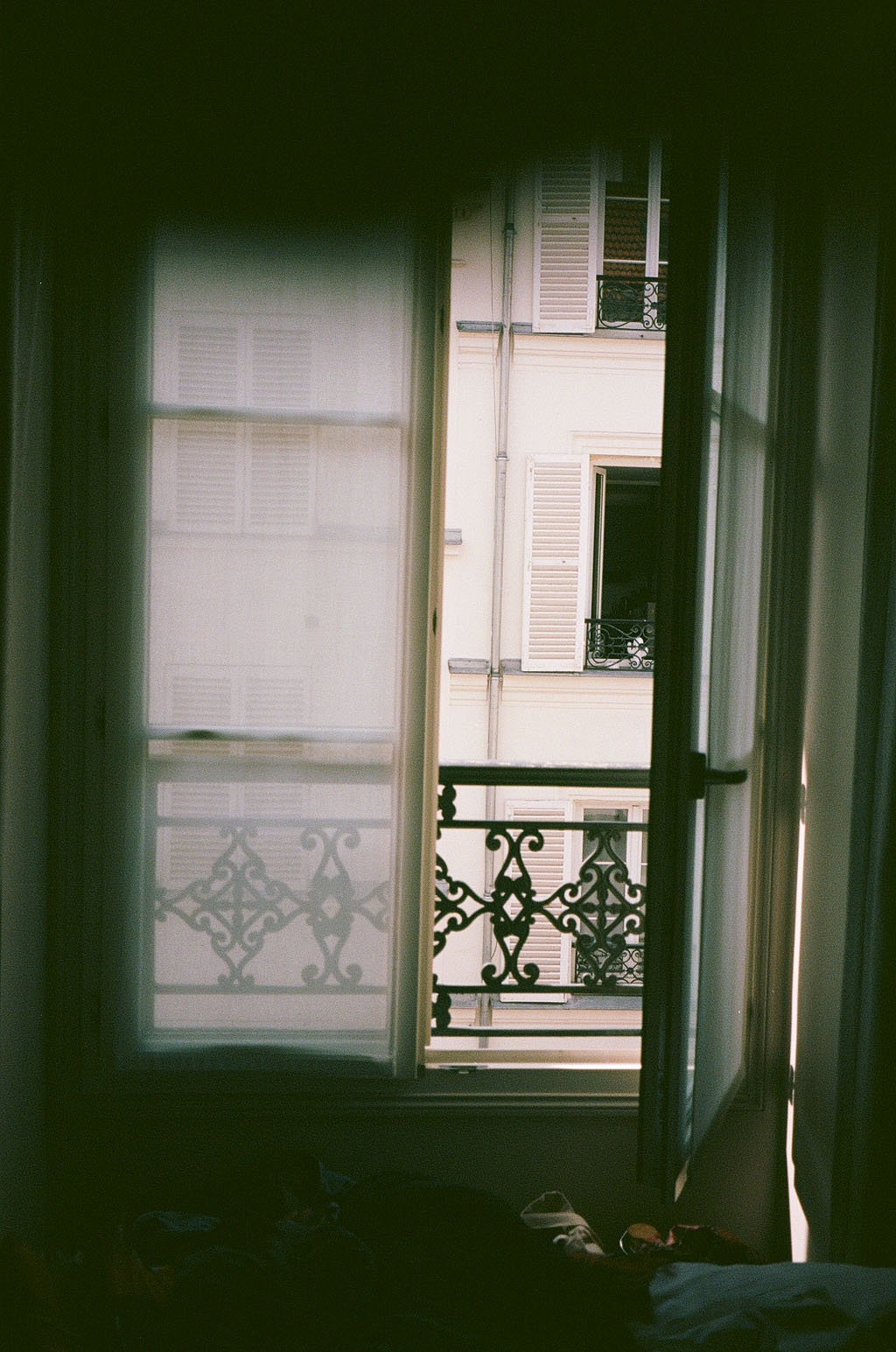 Quiet interior with green-tinted window light
