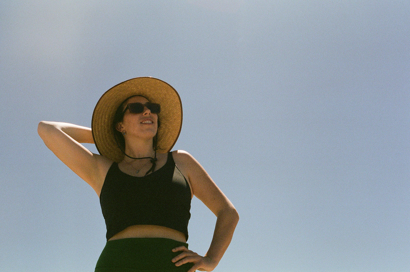 Portrait against a pale blue sky
